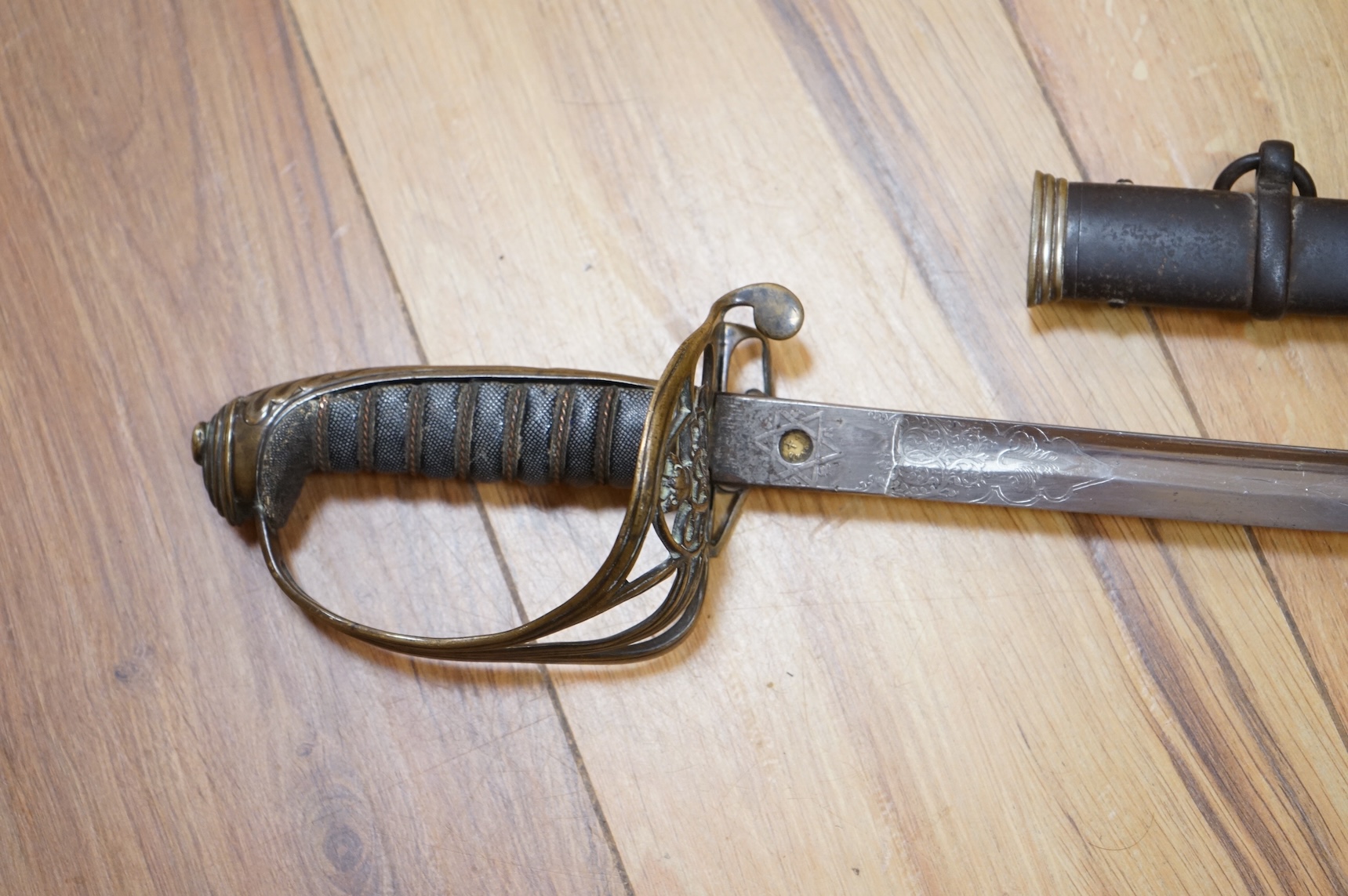 A Victorian 1845 pattern infantry officer’s levee sword, with slender blade etched; Hamburger Rogers & Co., and crowned VR and foliage, regulation pierced brass guard with folding side guard, wire bound fish skin covered